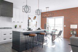 Kitchen and Dining Area with Brick Feature Wall in The Orlando Showhome in Rosewood at Secord Edmonton