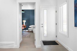 Bright White Modern Entryway in The Grahame Showhome