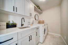 laundry room in the midland showhome by western living homes